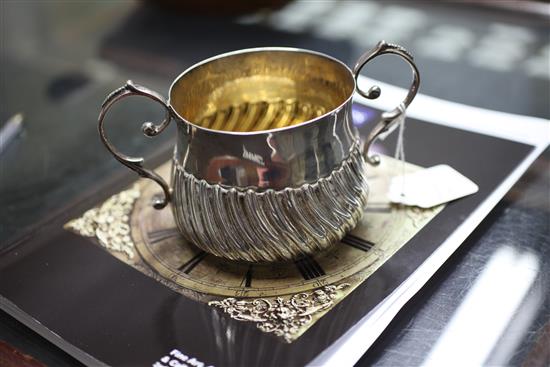 A George III demi-wrythened repousse silver porringer, 8 oz.